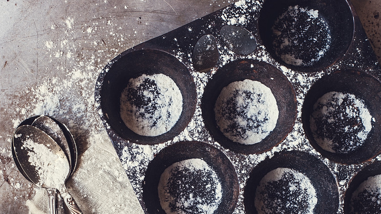 Muffin tin with flour
