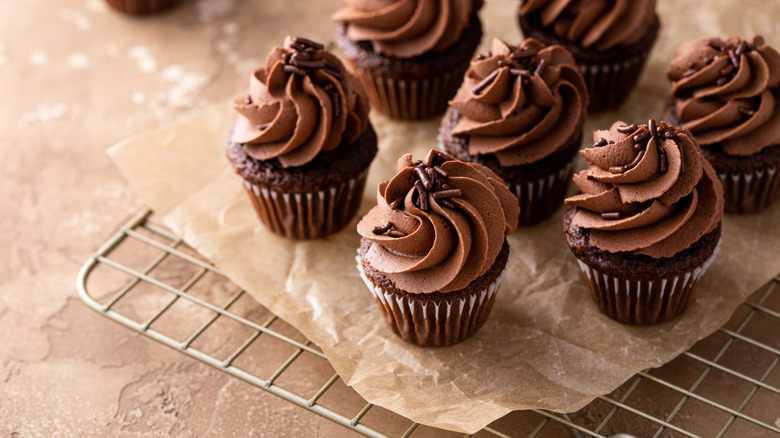 Chocolate cupcakes on a cooling rack