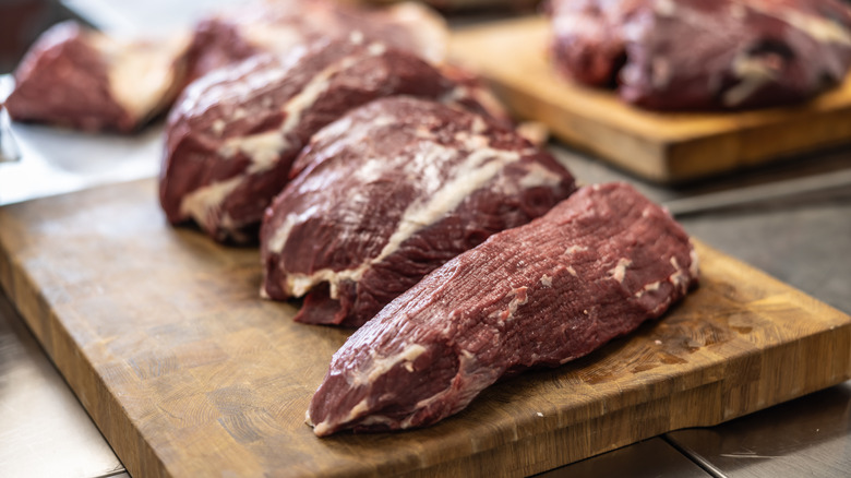 Various types of sliced ​​beef on cutting boards