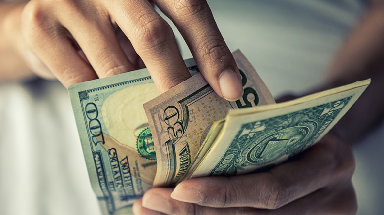 holding money