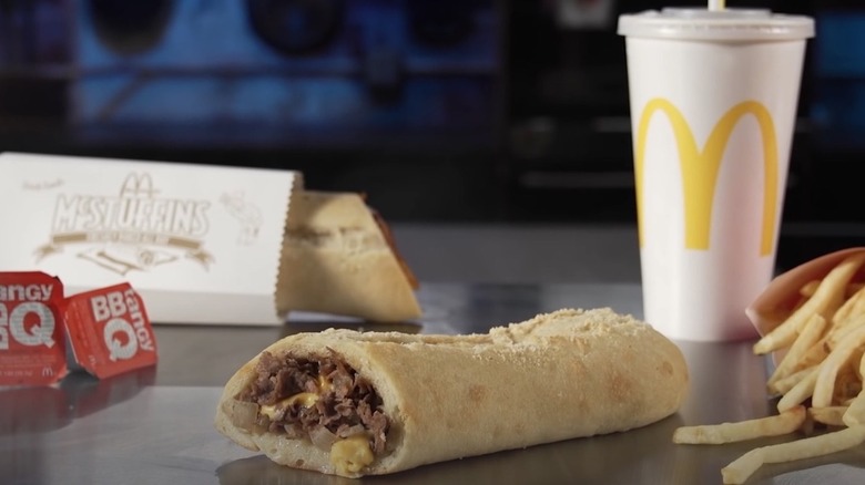 A McDonald's McStuffin with fries, BBQ sauce, and a drink