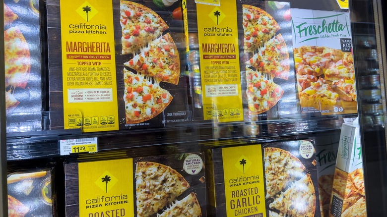 Frozen pizza boxes in freezer