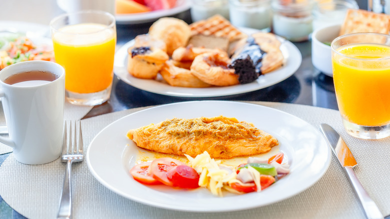 Plate with omelette and tomatoes