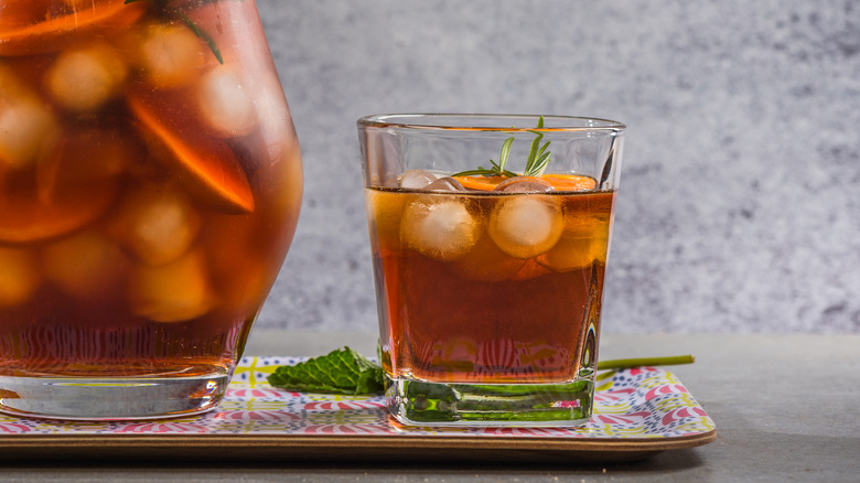 A pitcher and glass of sweet tea