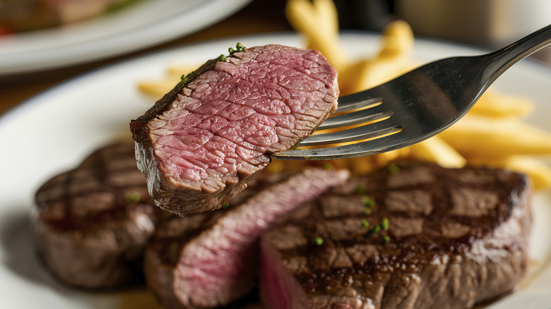 Piece of steak on fork