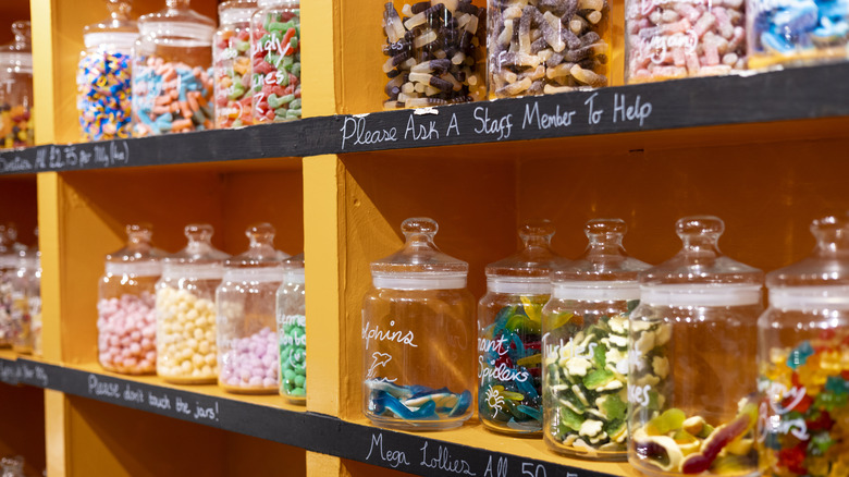 Various jars of candy in a shop.