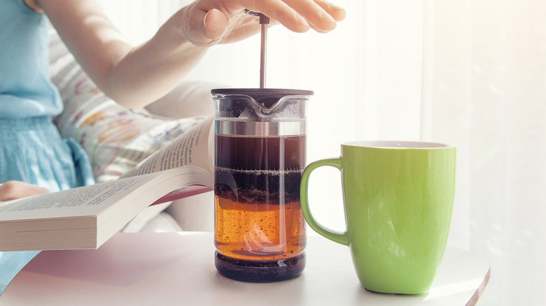 Person pressing French press