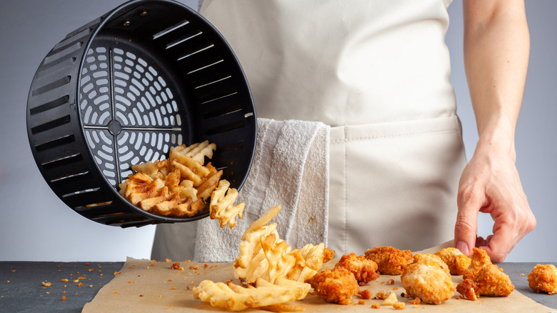 Air-fryer basket poured onto board