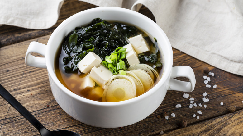 white bowl of tofu veggie soup