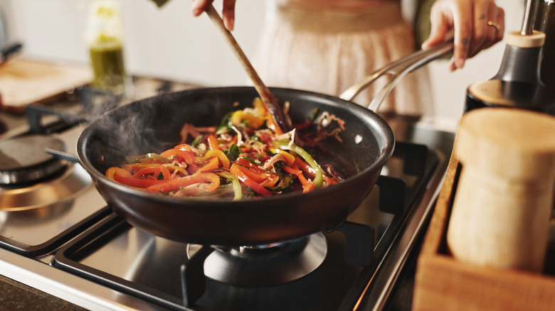 Person cooking stir fry