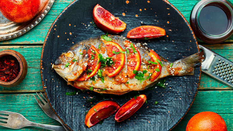 whole roasted fish on a plate