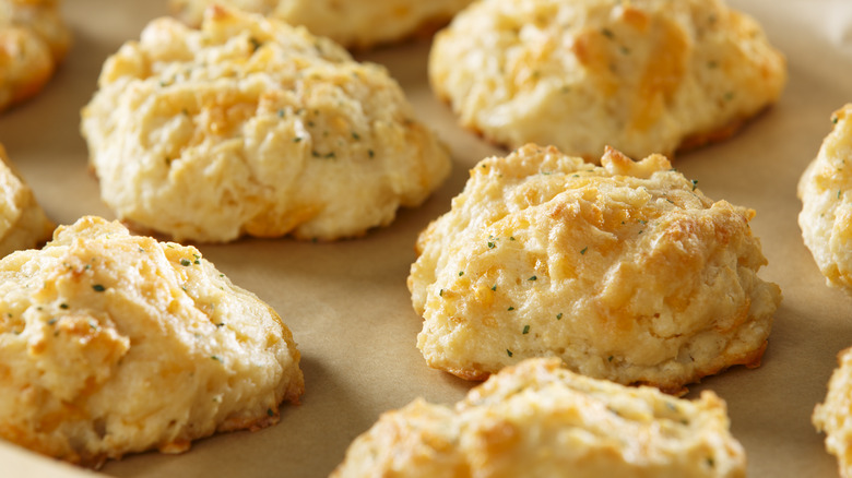 Cheddar biscuits on parchment paper