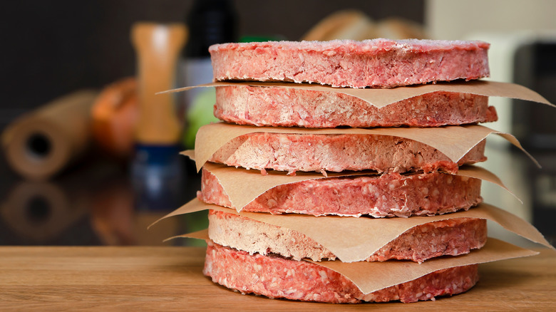 Frozen burger patties stacked up
