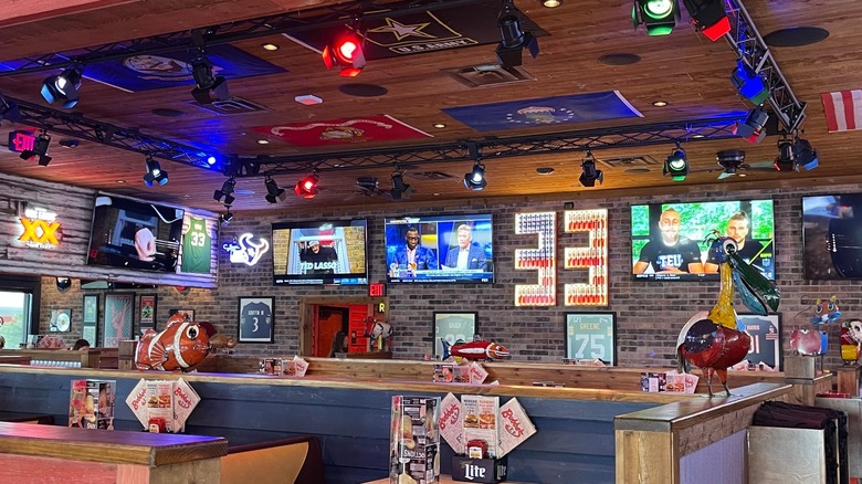 Interior of a Bubba's 33 location showing many wall-mounted televisions