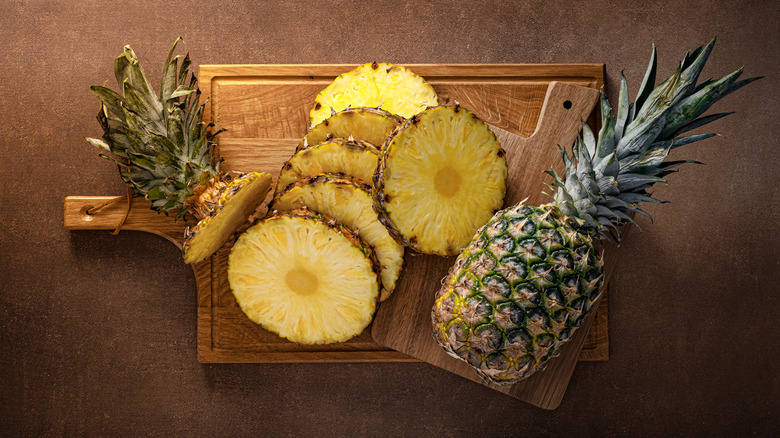 Slices of pineapple on cutting board