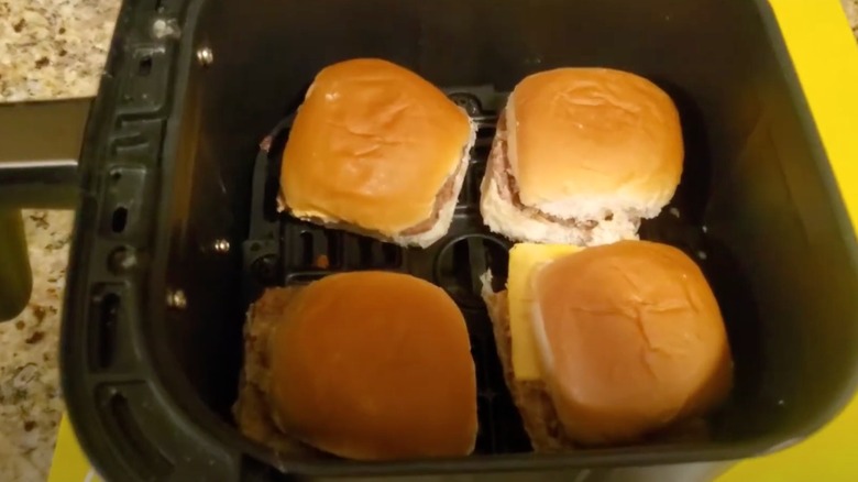 Frozen sliders in an air fryer basket