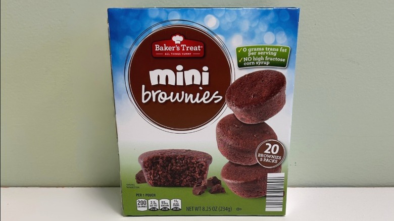 A box of Baker's Treat Mini Brownies on a green and white background