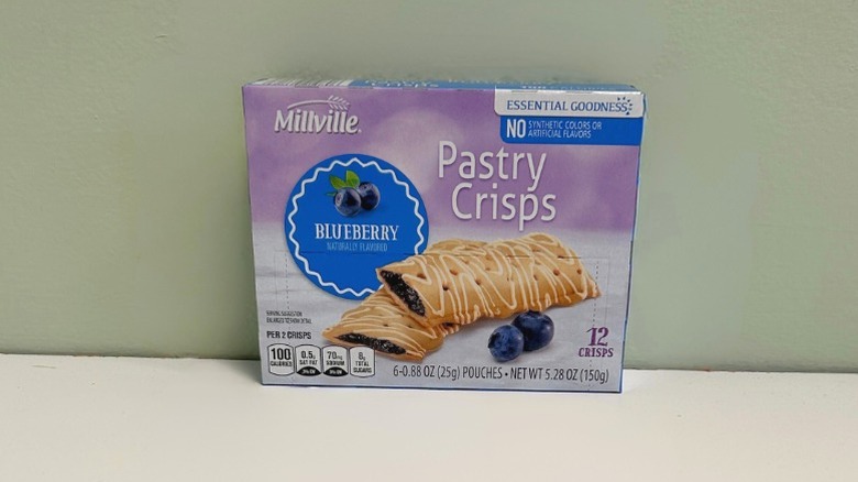A box of Millville Blueberry Pastry Crisps on a green and white background