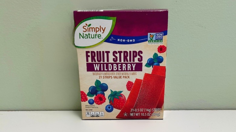 A box of Simply Nature Wildberry Fruit Strips on a green and white background
