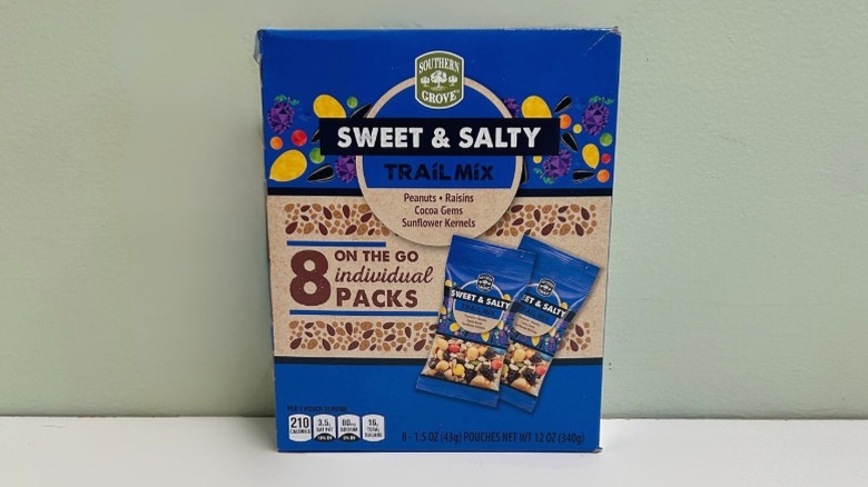A box of Southern Grove Sweet and Salty Trail Mix on a green and white background
